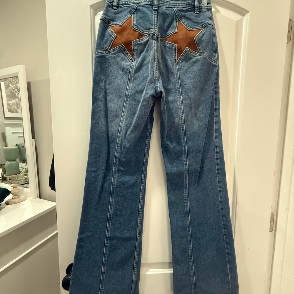 Free People Blue Flare Jeans with Brown Star Details